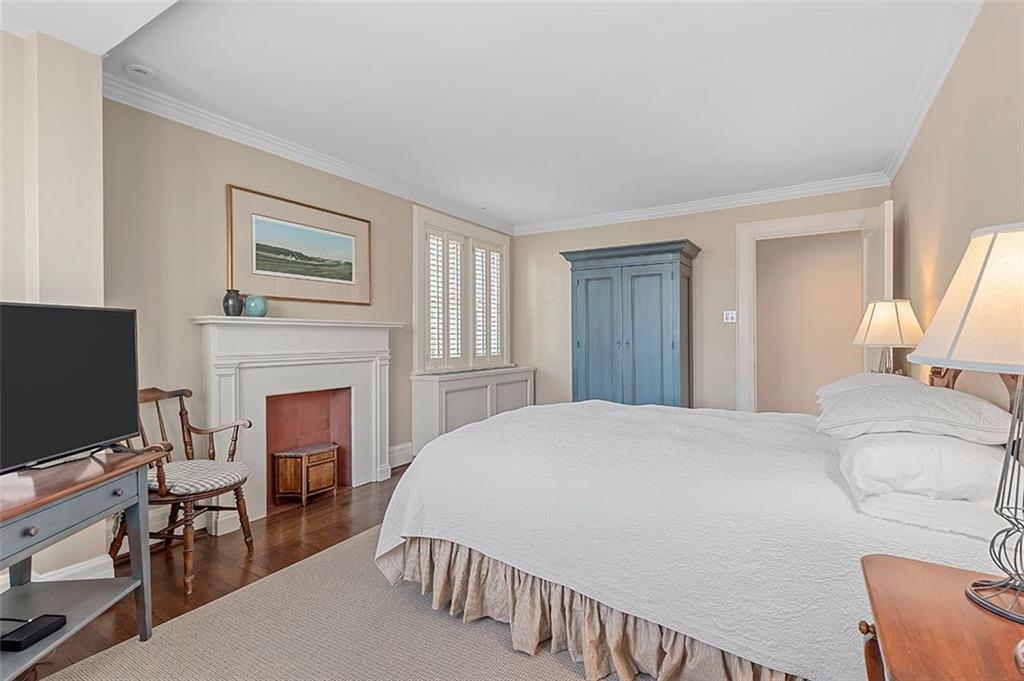 1342 Inverness Avenue Pittsburgh, PA 15217 - Photo 22 of 40 a bedroom with a bed and a fireplace