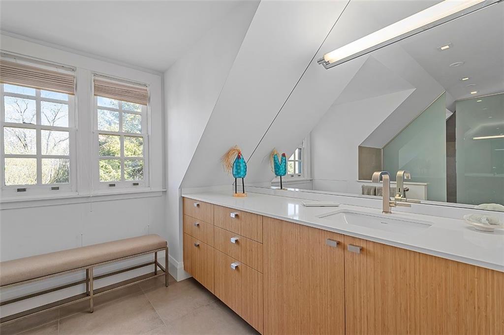 1342 Inverness Avenue Pittsburgh, PA 15217 - Photo 29 of 40 a bathroom with a granite countertop sink mirror and a window