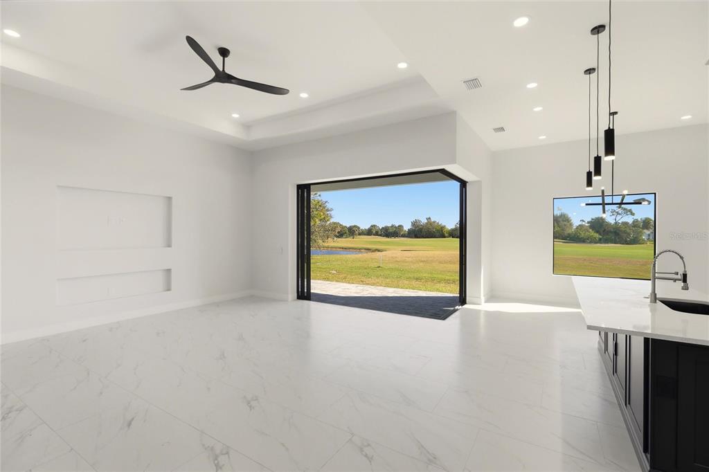 17 Long Meadow Road Rotonda West, FL 33947 - Photo 12 of 37 a view of an empty room with a painting on the wall