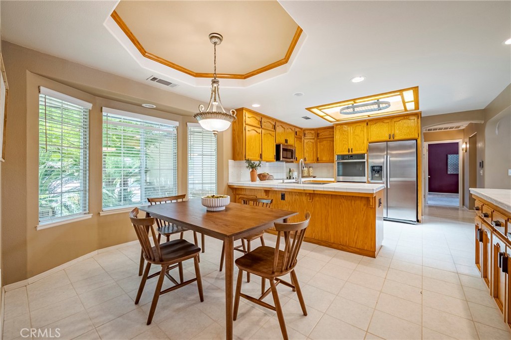 625 Redwing Drive Merced, CA 95340 - Photo 15 of 57 a view of a dining room with furniture window and outside view