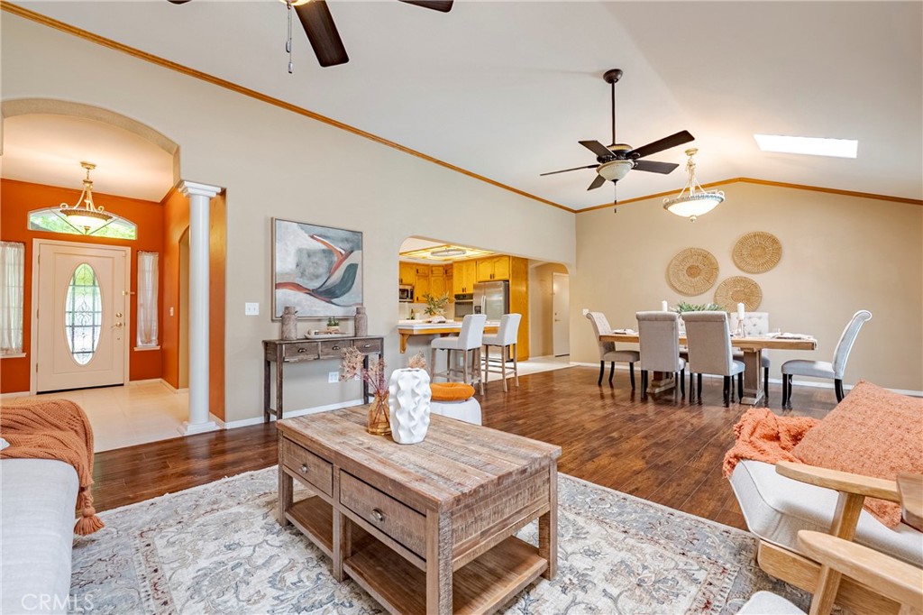 625 Redwing Drive Merced, CA 95340 - Photo 22 of 57 a living room with furniture a large window and a chandelier