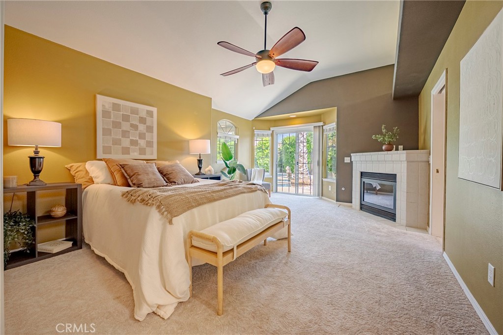 625 Redwing Drive Merced, CA 95340 - Photo 34 of 57 a spacious bedroom with a bed and a fireplace