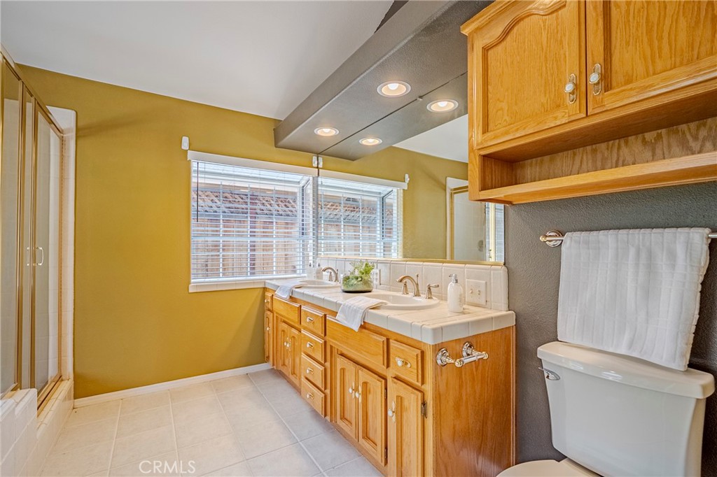 625 Redwing Drive Merced, CA 95340 - Photo 39 of 57 a bathroom with a sink a toilet and a shower