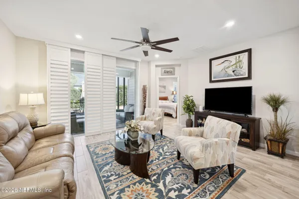 a living room with furniture or couch and a flat screen tv