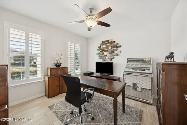 a workspace with furniture and a window