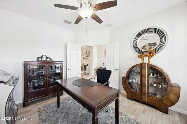 a view of a livingroom with furniture and entryway
