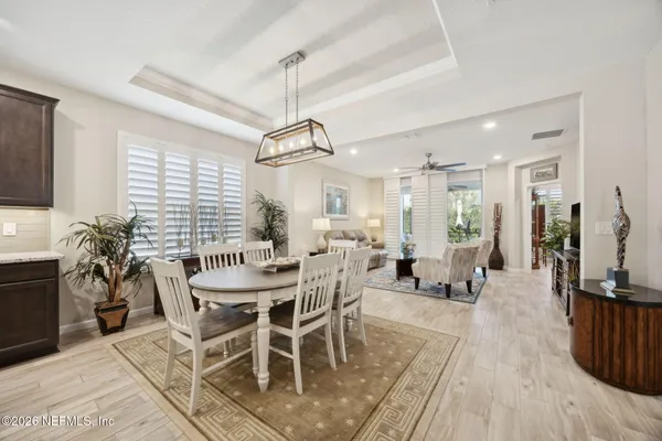 a view of a dining room with furniture window and outside view