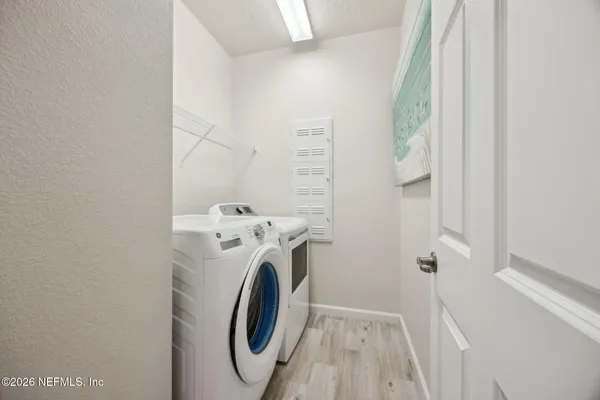 a utility room with dryer and washer