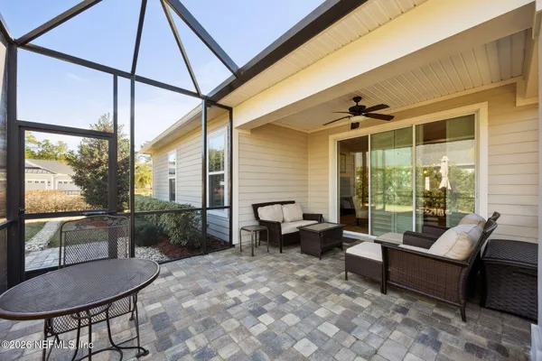 a outdoor space with patio the couches and a dining table with the garden view