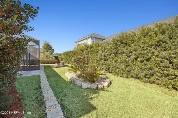 a view of a big yard with large trees