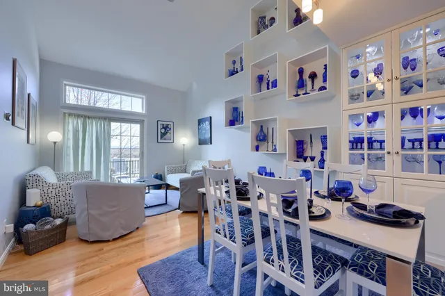 a view of a dining room with furniture and a window