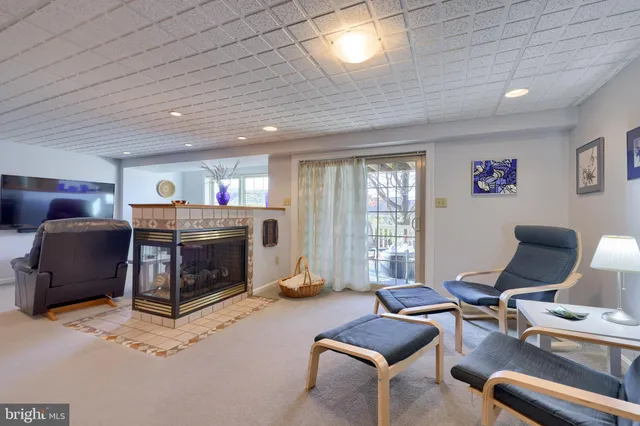a view of a livingroom with furniture and a workspace