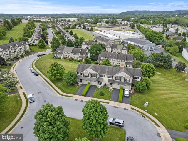 an aerial view of a house with a garden