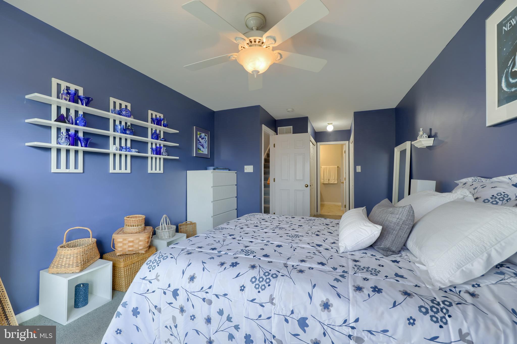 728 Skywalk Lane Lancaster, PA 17601 - Photo 23 of 39 a bedroom with a bed and a chandelier