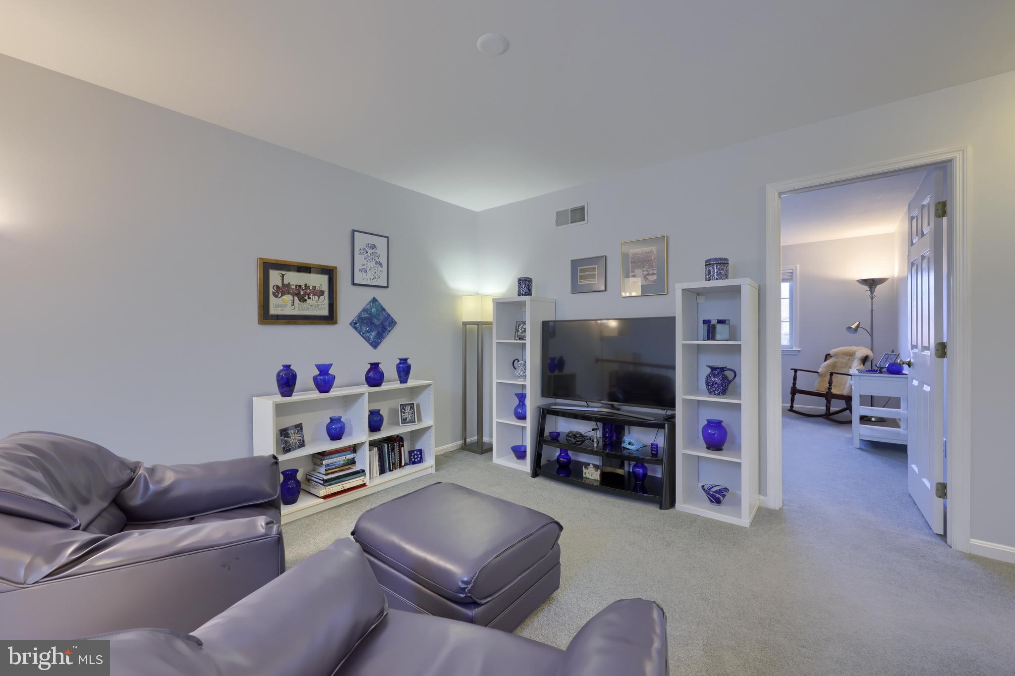 728 Skywalk Lane Lancaster, PA 17601 - Photo 27 of 39 a living room with furniture and a flat screen tv