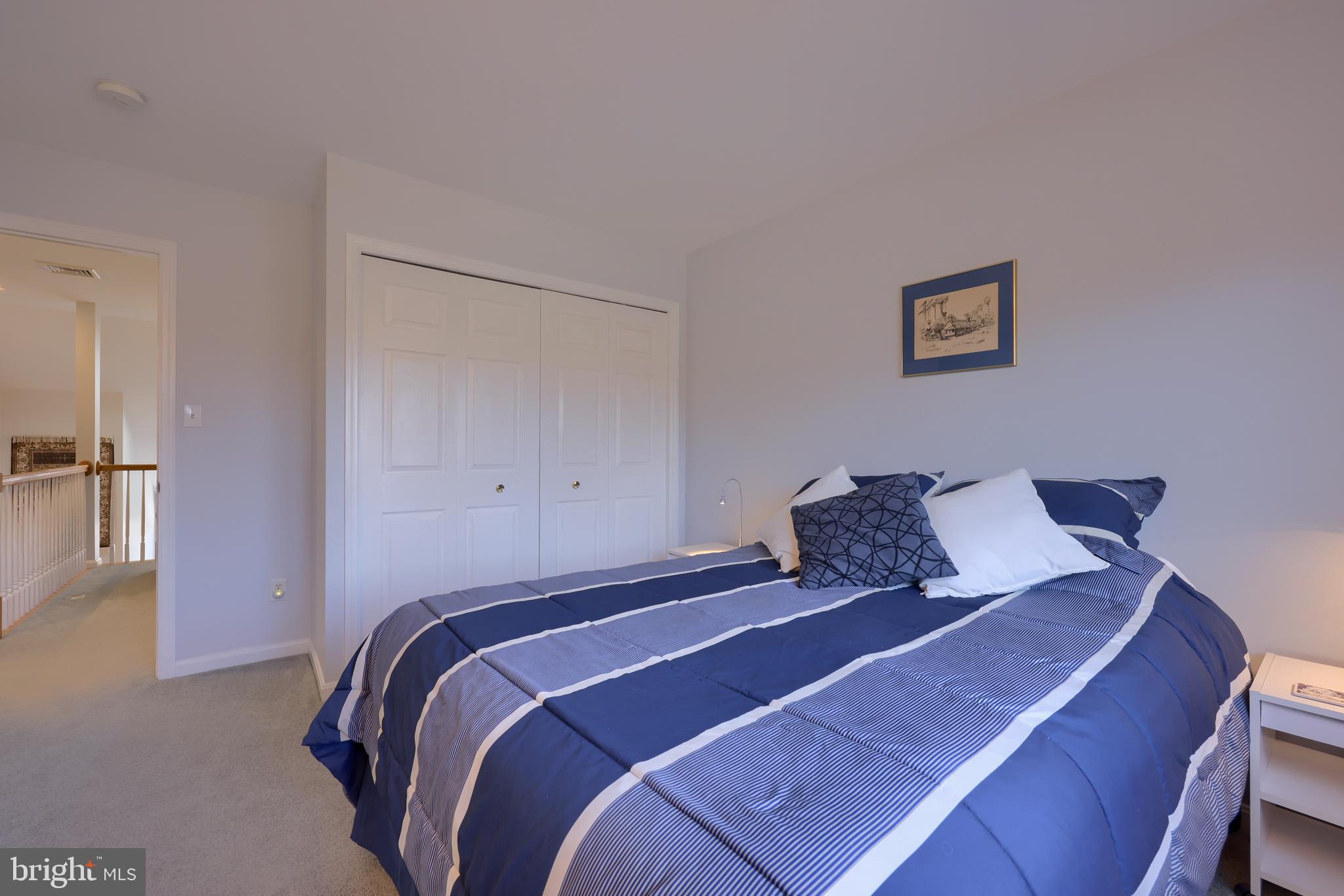 728 Skywalk Lane Lancaster, PA 17601 - Photo 29 of 39 a bedroom with a bed and painting on the wall