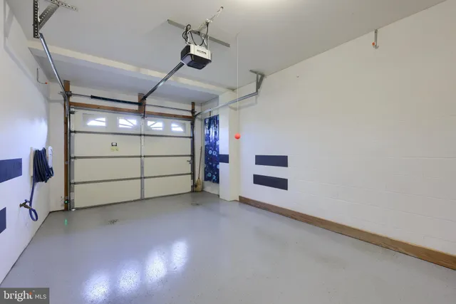a view of a patio with a table and chairs