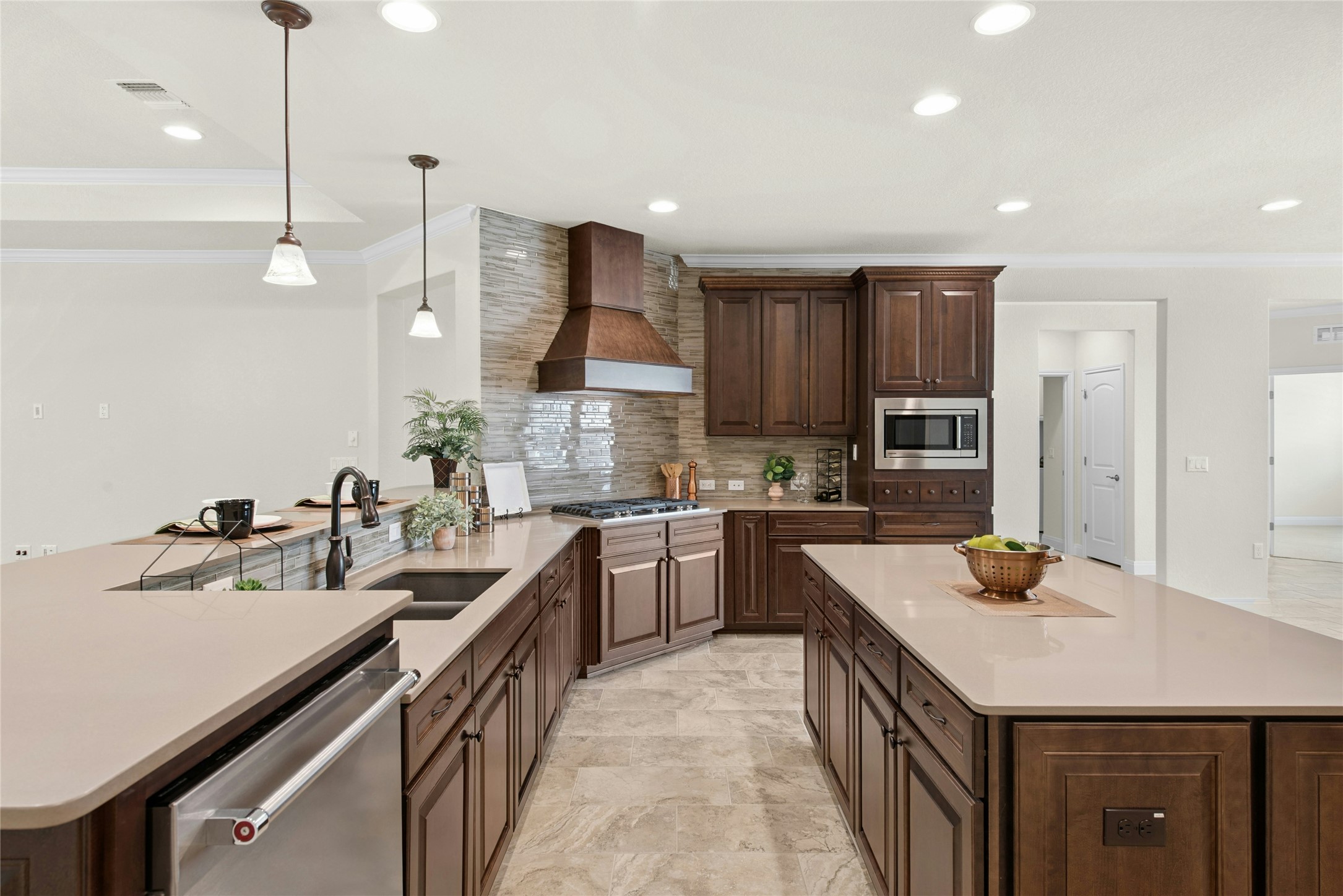105 Marfa Cove Georgetown, TX 78633 - Photo 13 of 36 a kitchen with a sink a counter space appliances and cabinets