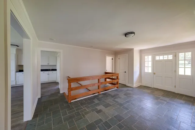 a bedroom with furniture and window