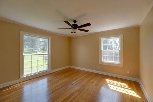 a view of a livingroom with furniture and flat screen tv