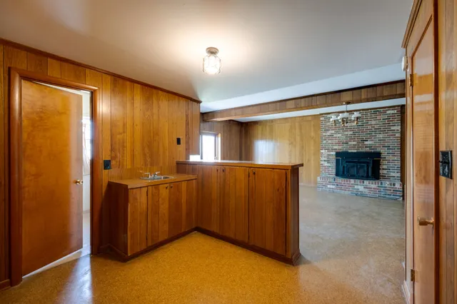 a view of room with stairs and furniture