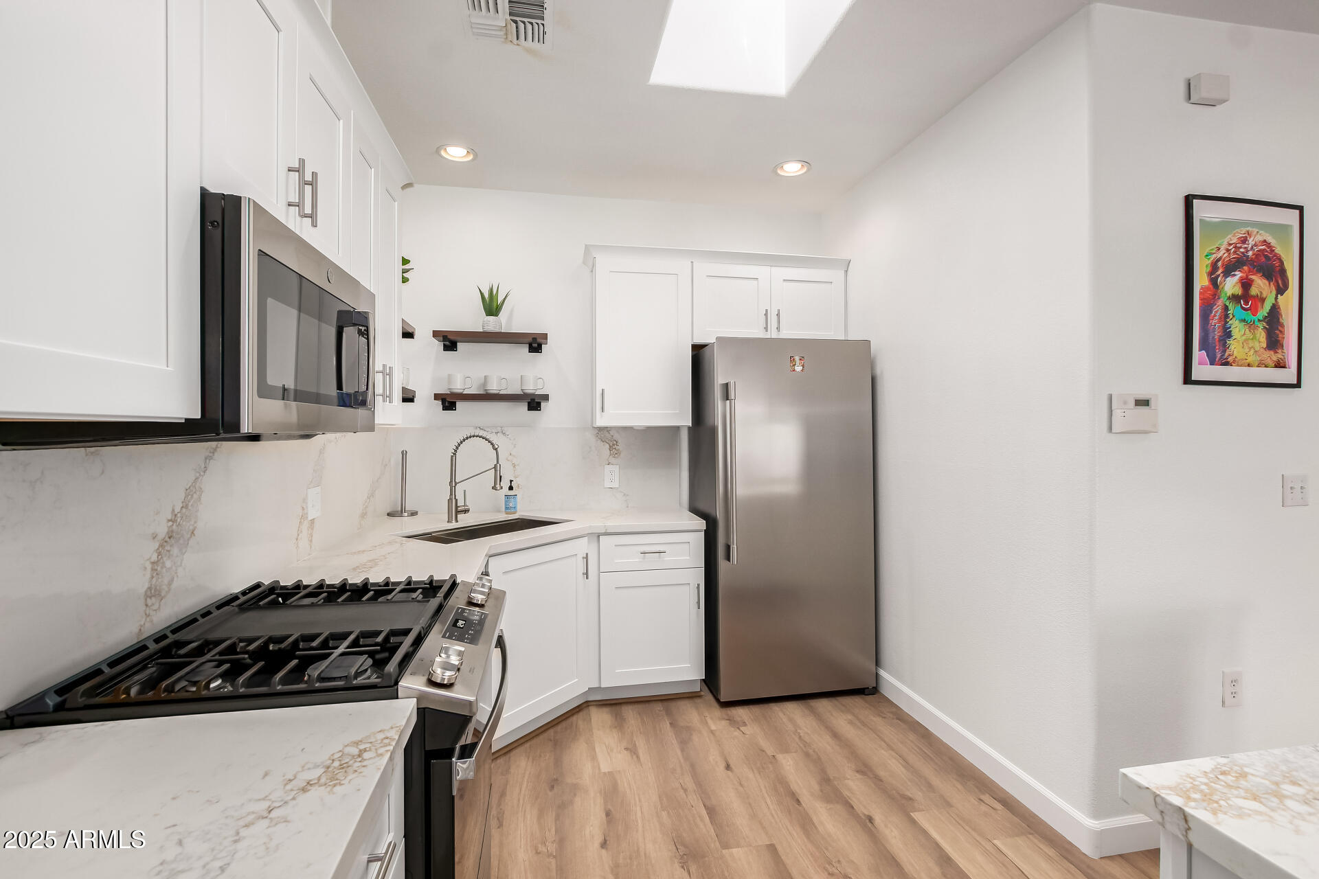 3221 North 37th Street, Unit 4 Phoenix, AZ 85018 - Photo 13 of 40 a kitchen with stainless steel appliances granite countertop a refrigerator and a stove