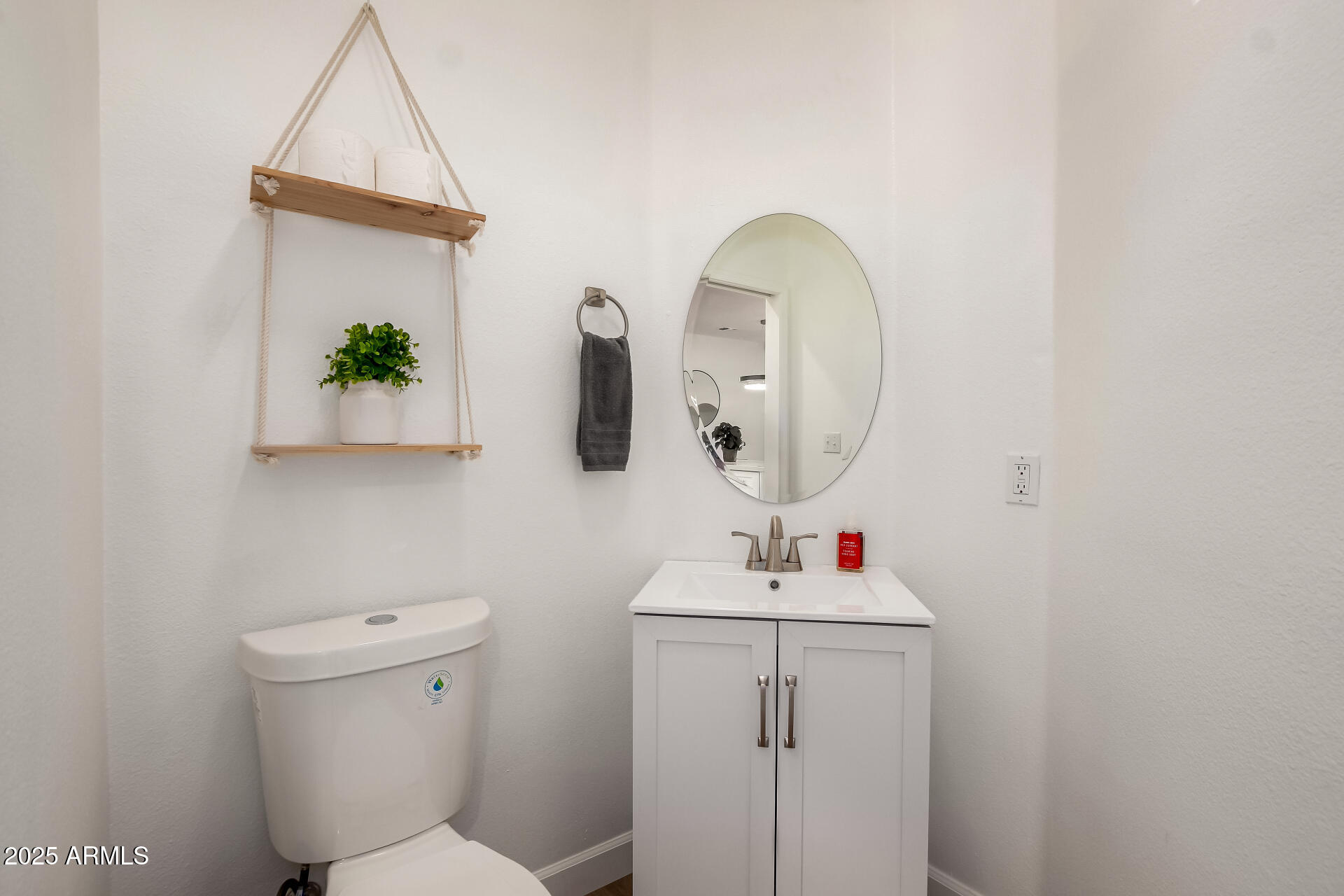 3221 North 37th Street, Unit 4 Phoenix, AZ 85018 - Photo 16 of 40 a bathroom with a sink toilet and mirror