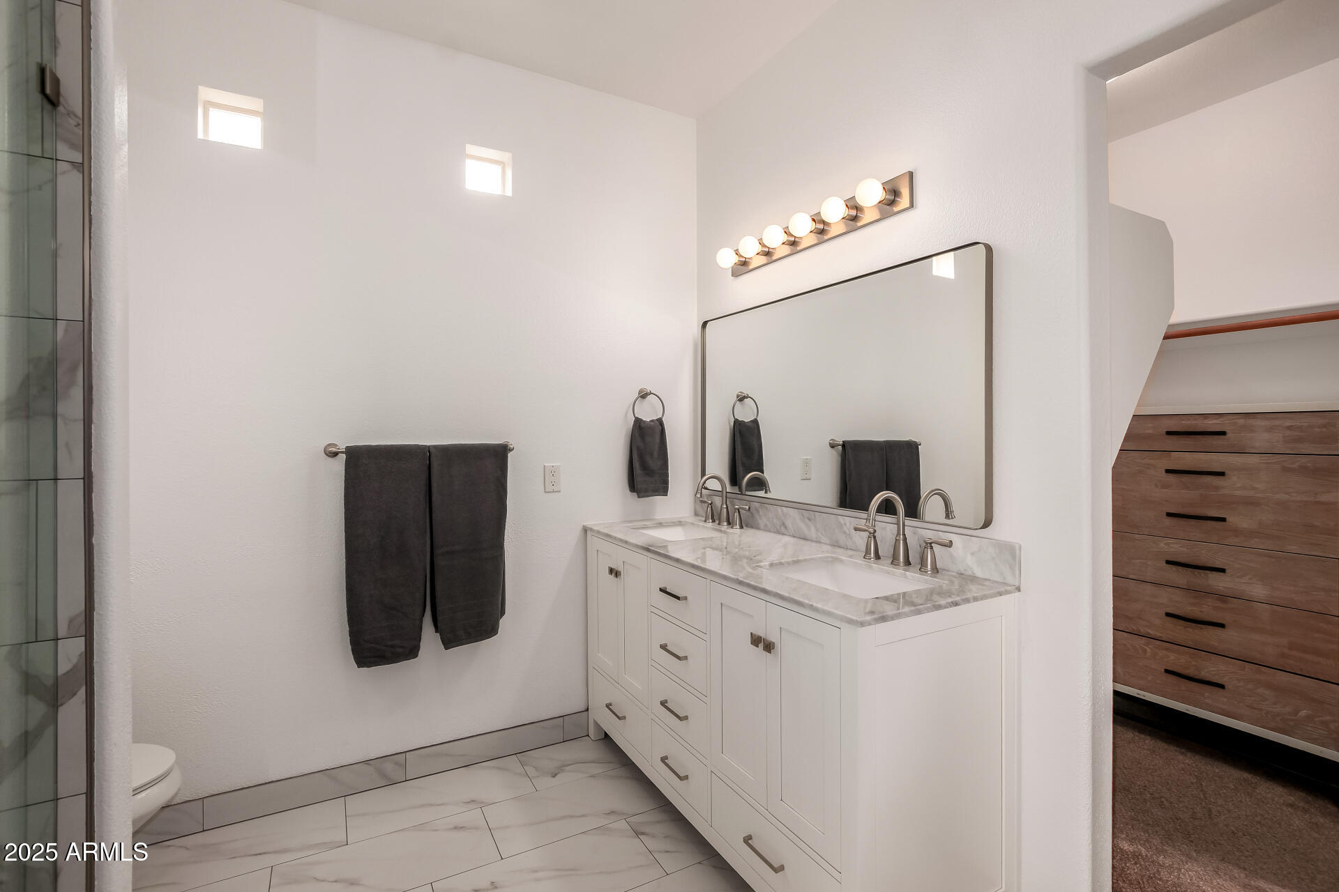 3221 North 37th Street, Unit 4 Phoenix, AZ 85018 - Photo 23 of 40 a bathroom with a sink and a mirror