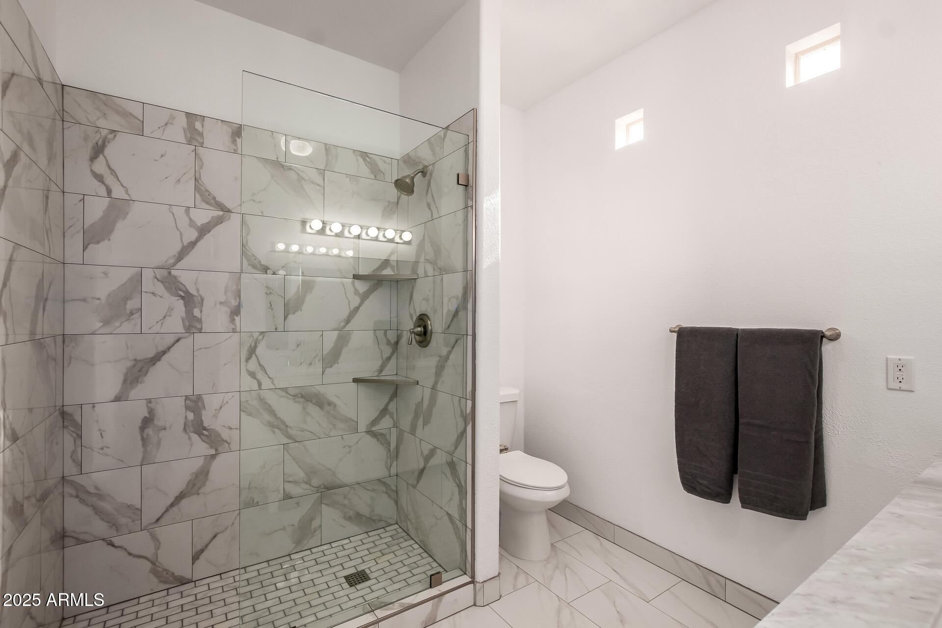 3221 North 37th Street, Unit 4 Phoenix, AZ 85018 - Photo 24 of 40 a bathroom with a toilet and a shower