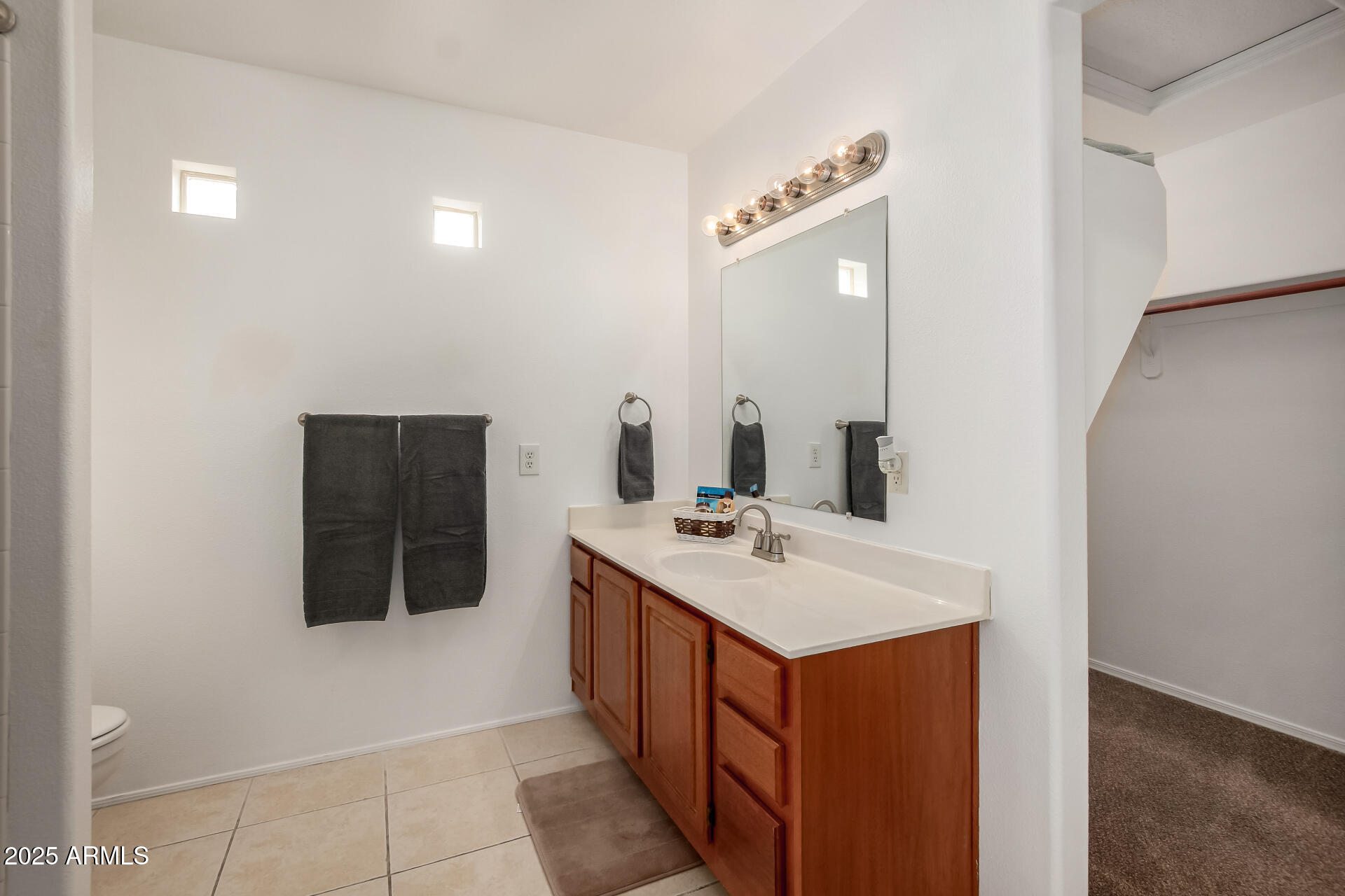 3221 North 37th Street, Unit 4 Phoenix, AZ 85018 - Photo 28 of 40 a bathroom with a sink and a mirror