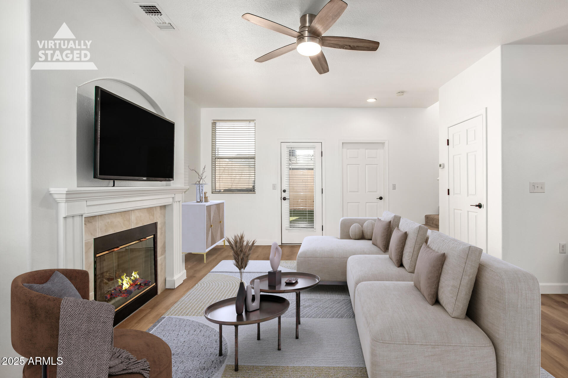 3221 North 37th Street, Unit 4 Phoenix, AZ 85018 - Photo 8 of 40 a living room with furniture a fireplace and a flat screen tv