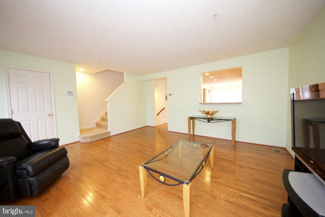 9878 Decatur Road Baltimore, MD 21220 - Photo 14 of 30 a living room with furniture and a flat screen tv