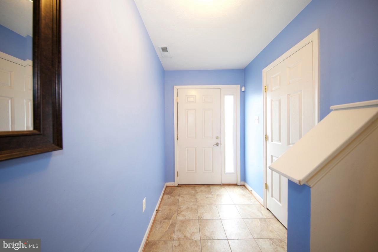 9878 Decatur Road Baltimore, MD 21220 - Photo 3 of 30 a view of a kitchen from the hallway