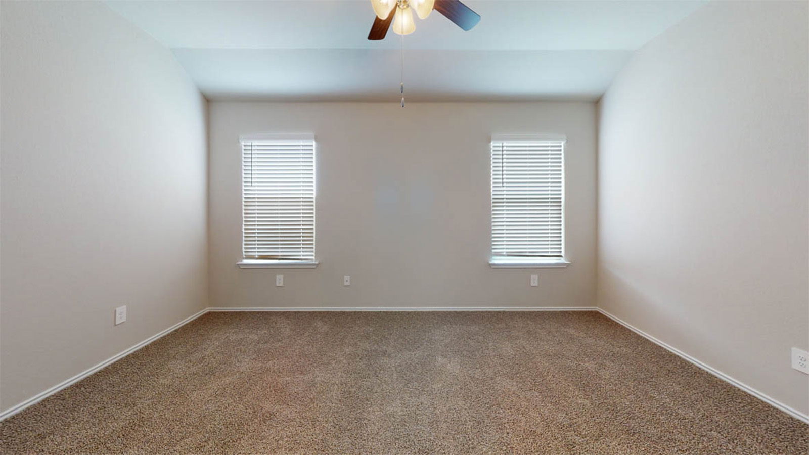 1417 Victory Rnch Trail Killeen, TX 76549 - Photo 8 of 22 A spacious primary bedroom features soft carpet and ample natural light from twin windows.