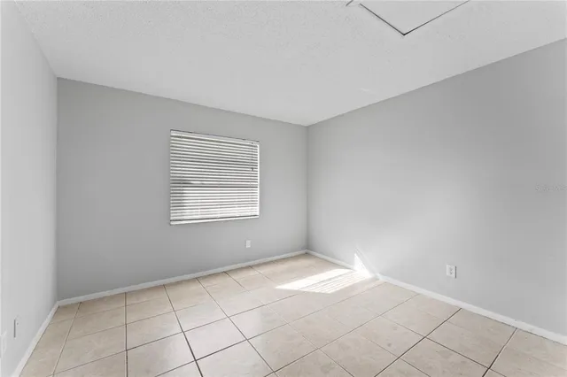 a view of a livingroom with a walk in closet and wooden floor