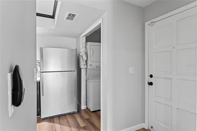 a view of walk in closet with white walls