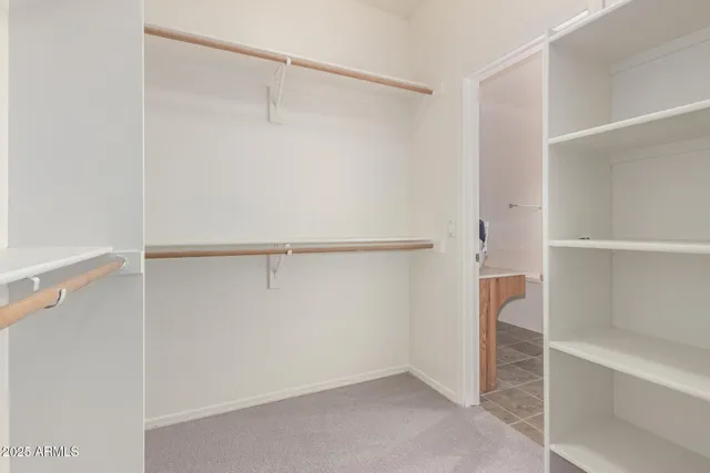 a view of an empty walk in closet