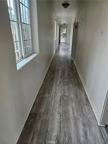 a view of gallery with wooden floor