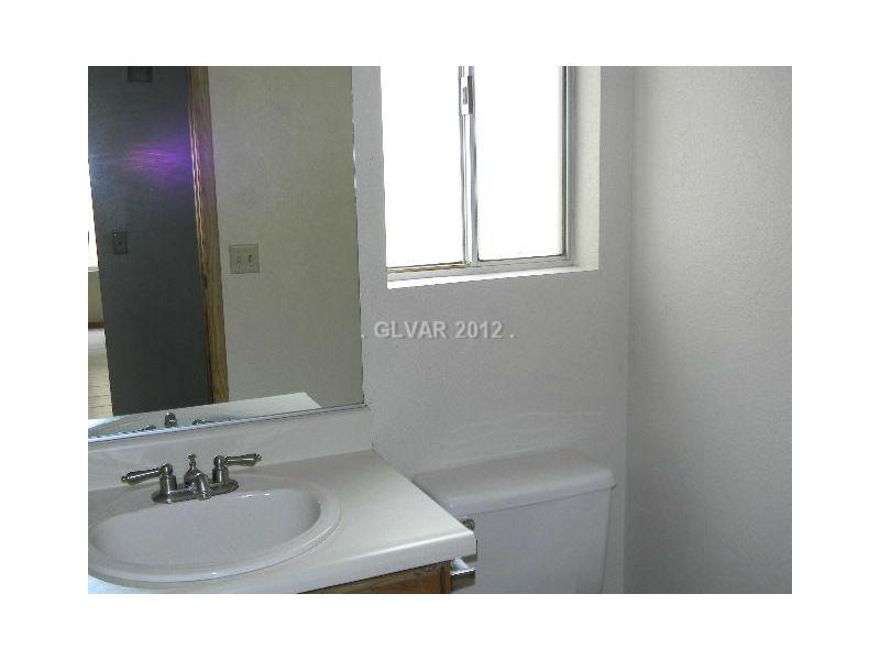 504 Inness Avenue Henderson, NV 89011 - Photo 12 of 29 Master Bath/Spa. MASTER BATHROOM IS 1/2 BATH THAT OPENS SEPARATE ROOM WITH TUB SHOWER COMBO THAT IS ALSO ACCESSED FROM THE HALL