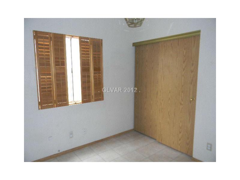 504 Inness Avenue Henderson, NV 89011 - Photo 13 of 29 Bedroom. 2ND BEDROOM WITH WOOD SHUTTERS