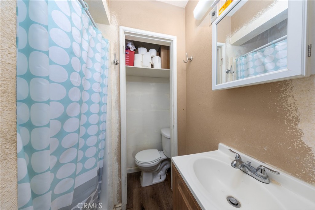 566 South Sage Avenue Rialto, CA 92376 - Photo 28 of 28 a bathroom with a sink and a toilet