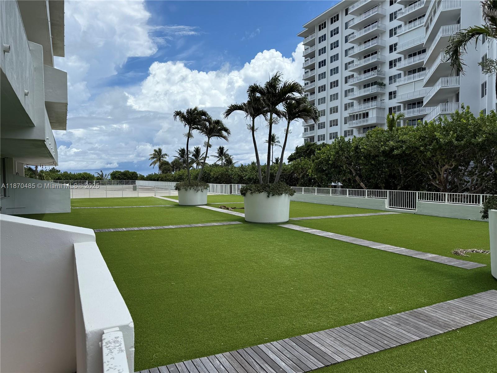 199 Ocean Ln Drive, Unit 203 Key Biscayne, FL 33149 - Photo 1 of 17 a view of a golf course with a lake view