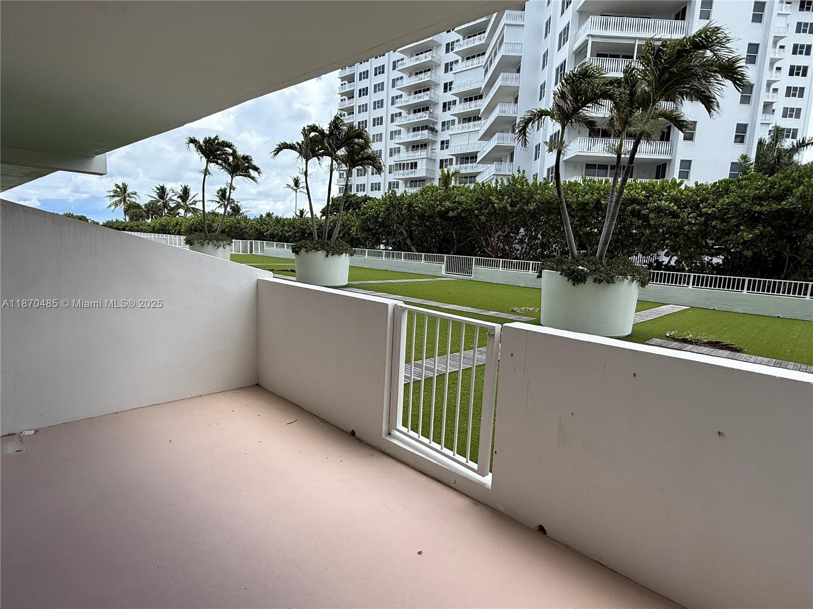 199 Ocean Ln Drive, Unit 203 Key Biscayne, FL 33149 - Photo 3 of 17 swimming pool view with a garden and plants