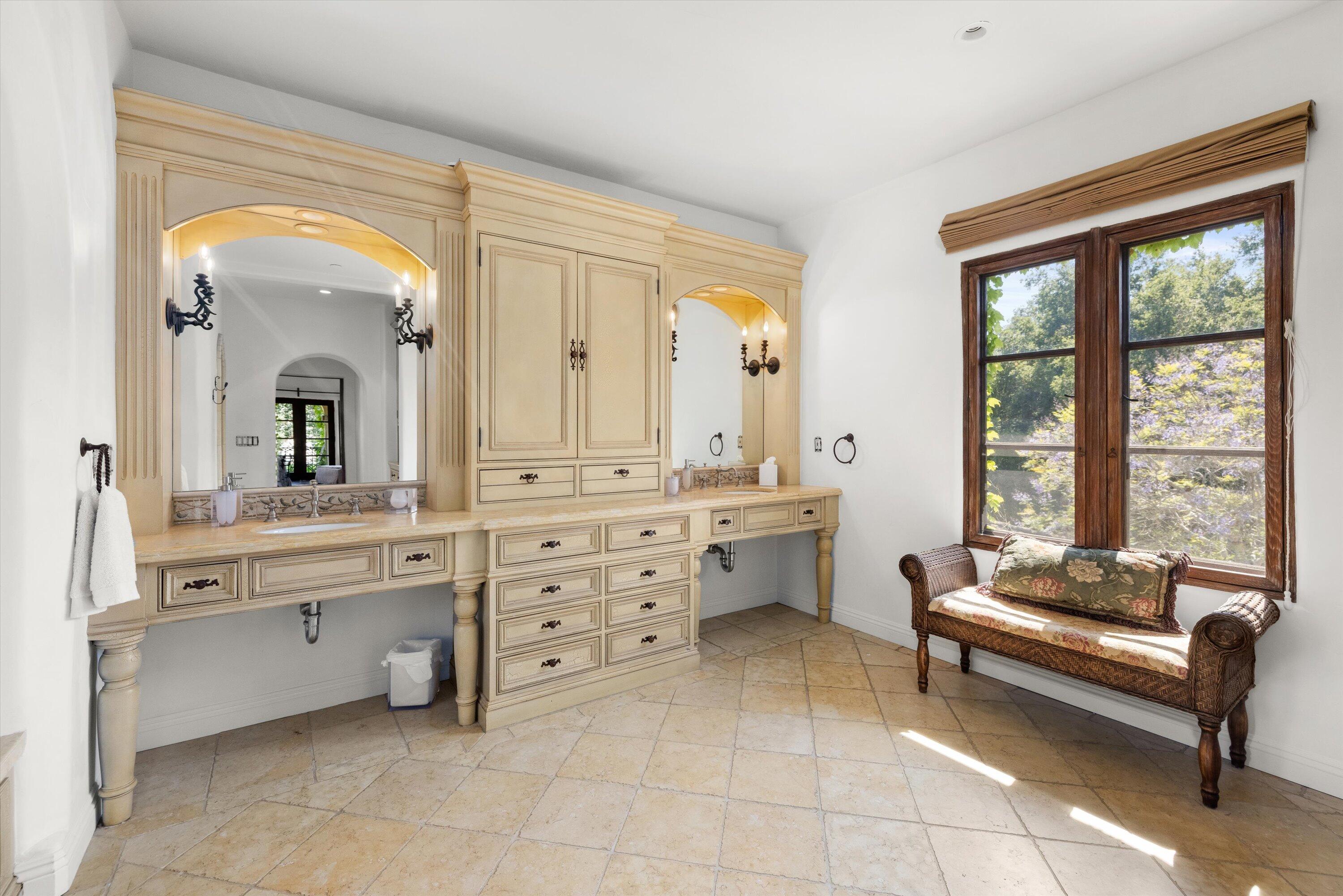 2222 East Valley Road Montecito, CA 93108 - Photo 17 of 30 a spacious bathroom with a mirror a double vanity sink and a bathtub