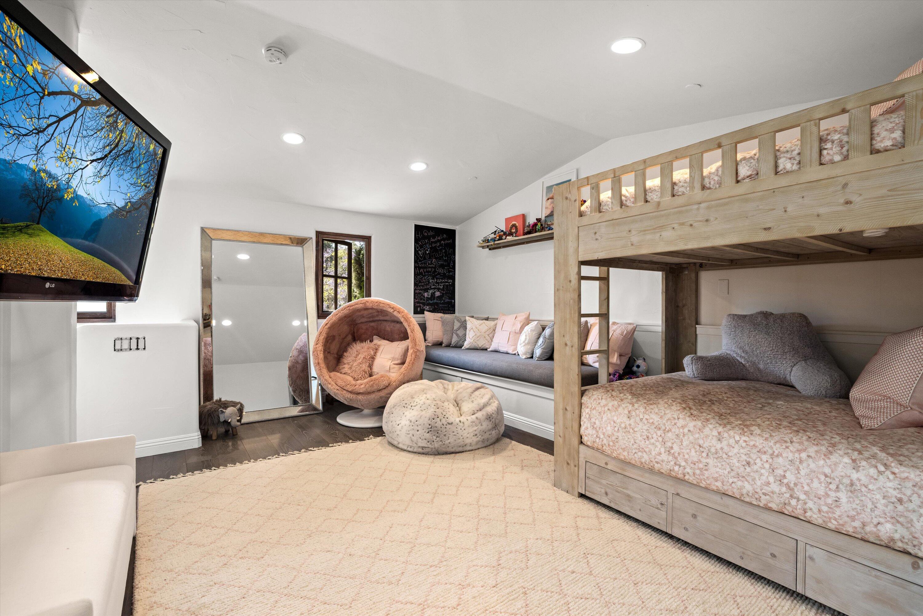 2222 East Valley Road Montecito, CA 93108 - Photo 18 of 30 a bedroom with a large bed and a chandelier