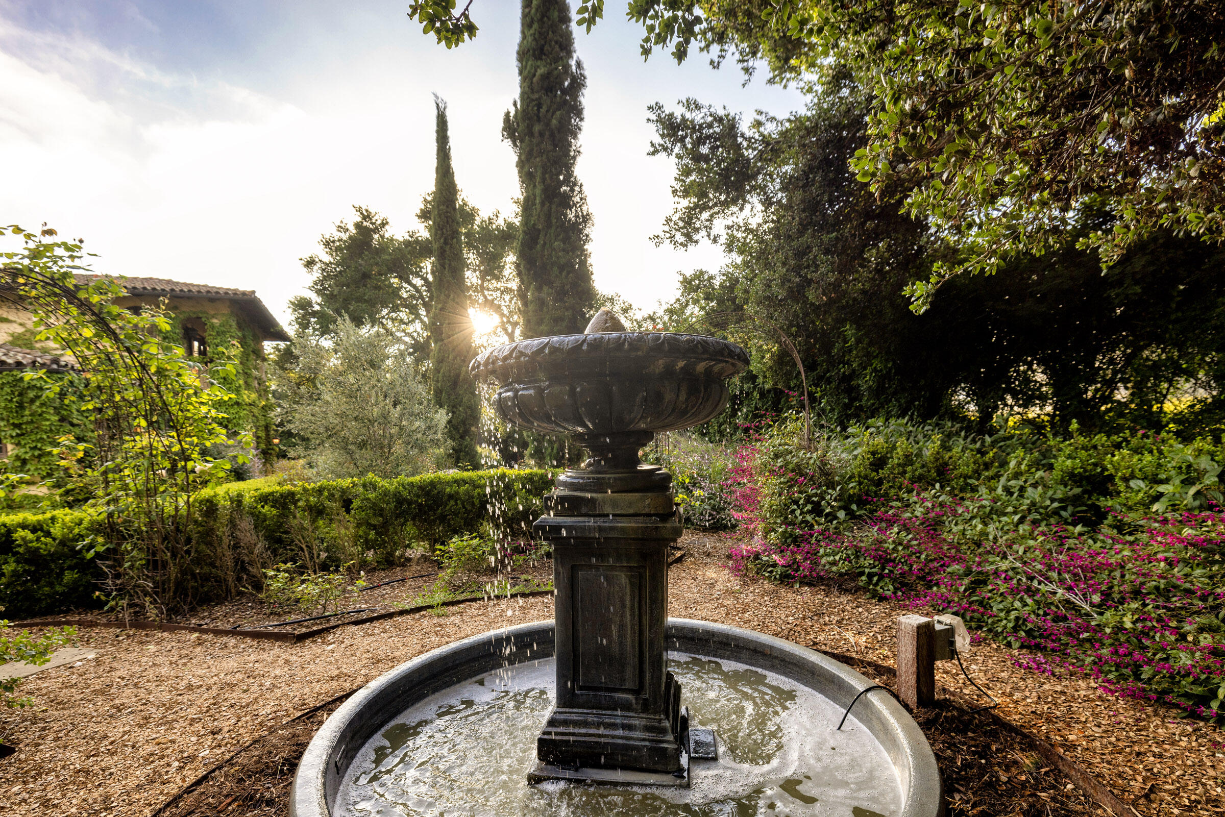 2222 East Valley Road Montecito, CA 93108 - Photo 24 of 30 a view of a fountain in the yard
