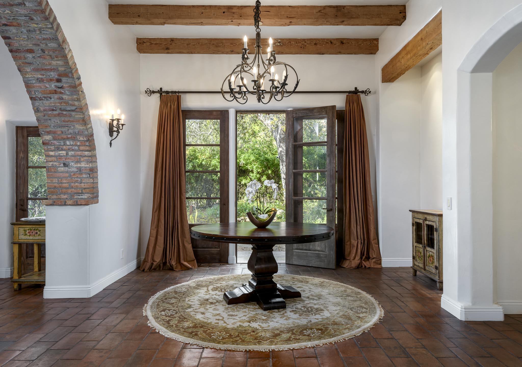 2222 East Valley Road Montecito, CA 93108 - Photo 5 of 30 a view of a dining room with furniture wooden floor a chandelier