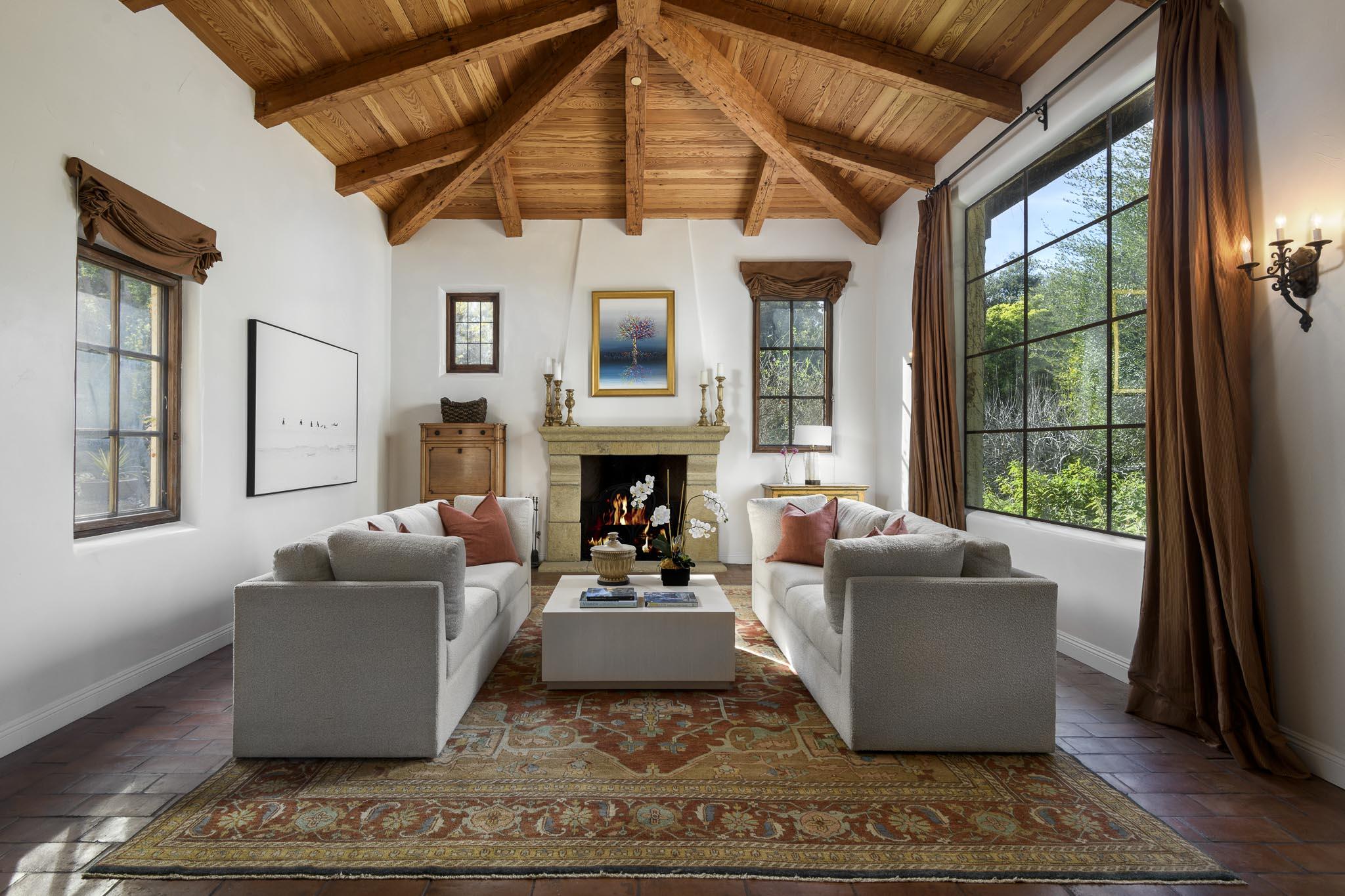 2222 East Valley Road Montecito, CA 93108 - Photo 8 of 30 a living room with furniture a fireplace and a large window