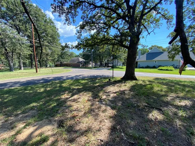 a view of a yard with of trees