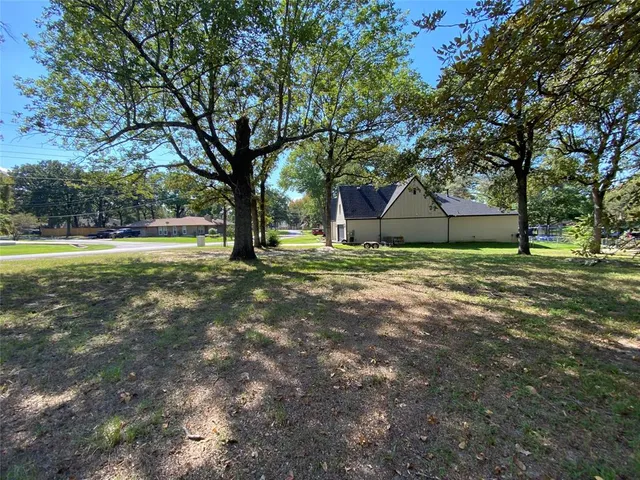 a house with trees in the background